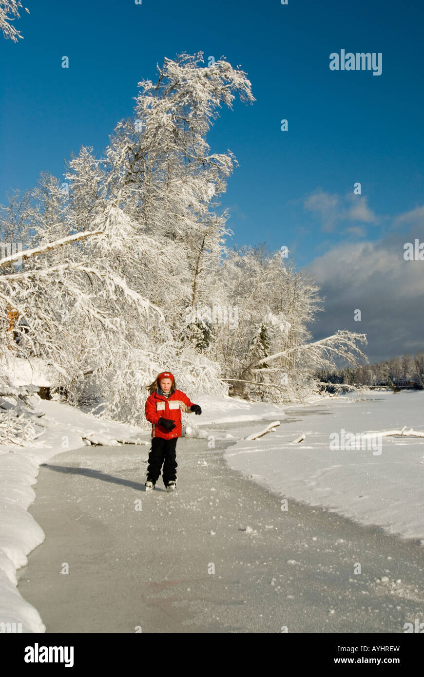 Skating on frozen lake Stock Photo - Alamy