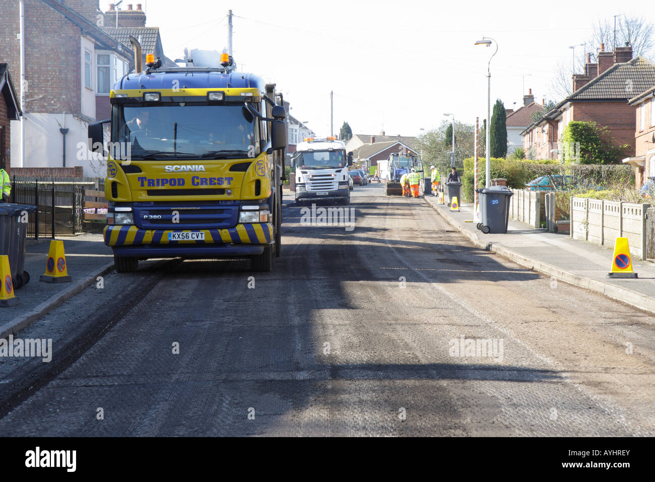 Tipper lorries ready to deliver new tar macadam Stock Photo