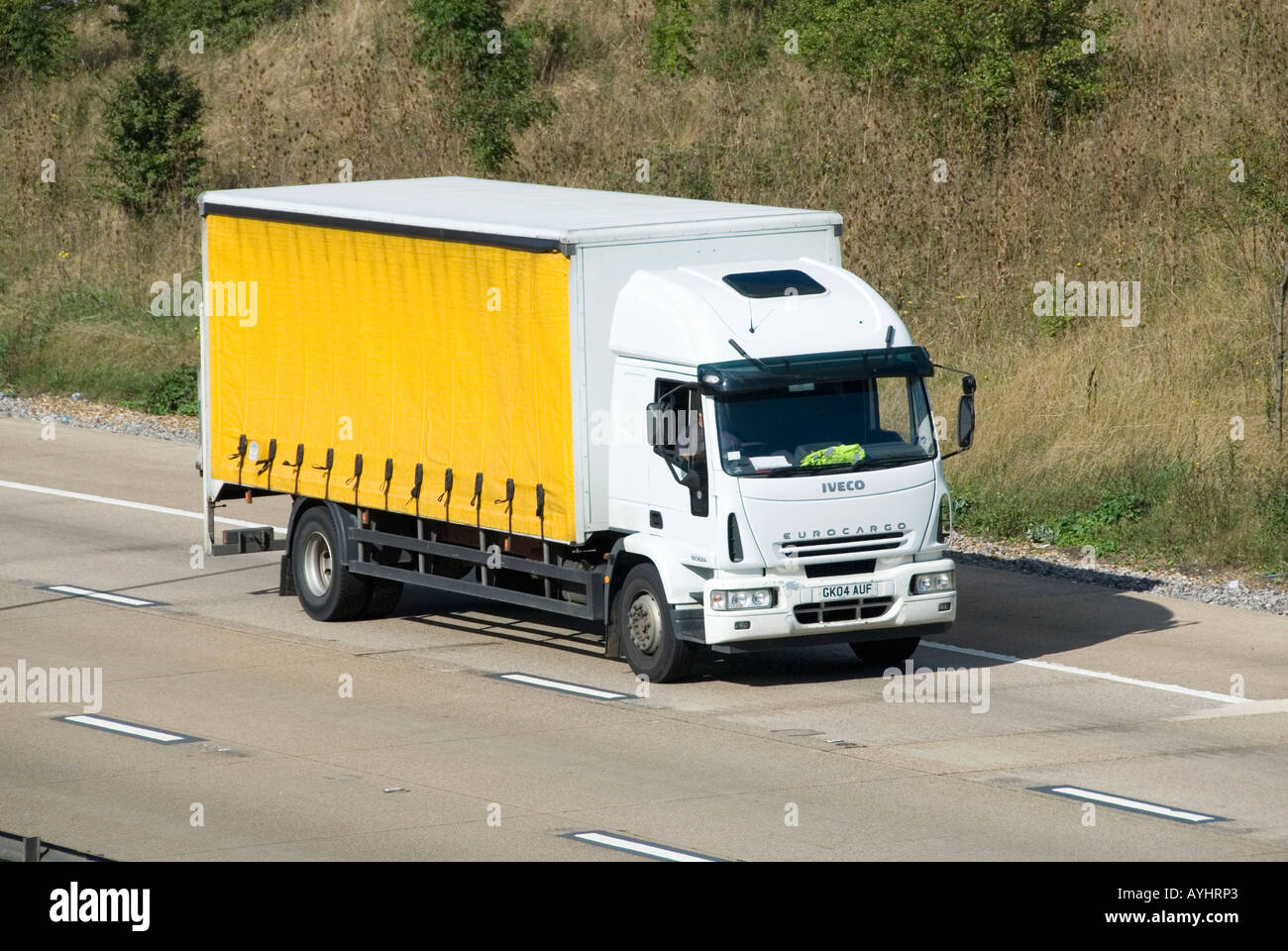 M25 motorway unmarked clean rigid base lorry with soft sides Stock Photo