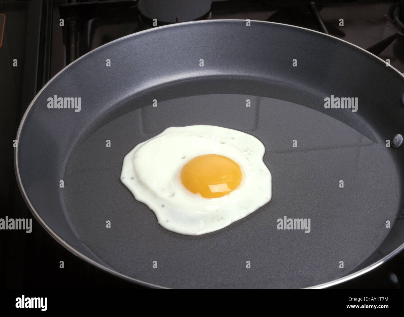 Fried egg in non stick frying pan Stock Photo