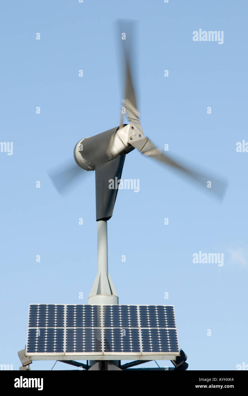 Moving wind turbine combined with solar panels to generate electricity Stock Photo