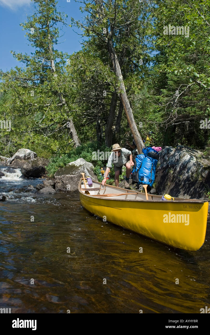 man loading canoe for canoe trip Stock Photo Alamy