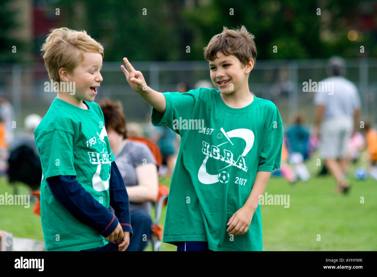 Boys age 7 celebrating on soccer field. Carondelet Field by Expo School St Paul Minnesota USA Stock Photo