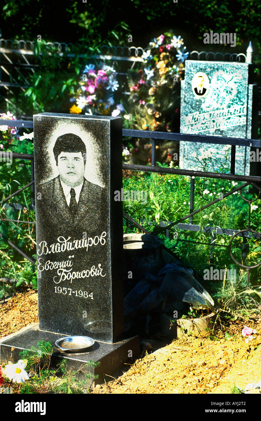Grave stones in graveyard Russian cemetery on the outskirts of Moscow Russia Stock Photo