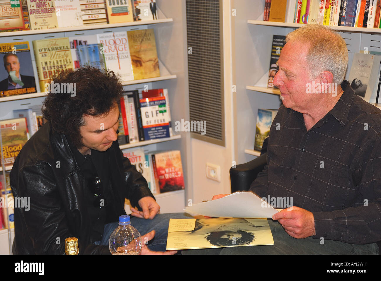 Frank Lisciandro with a fan at the presentation of his new book 'Jim Morrison : diario fotografico' in Padova Stock Photo