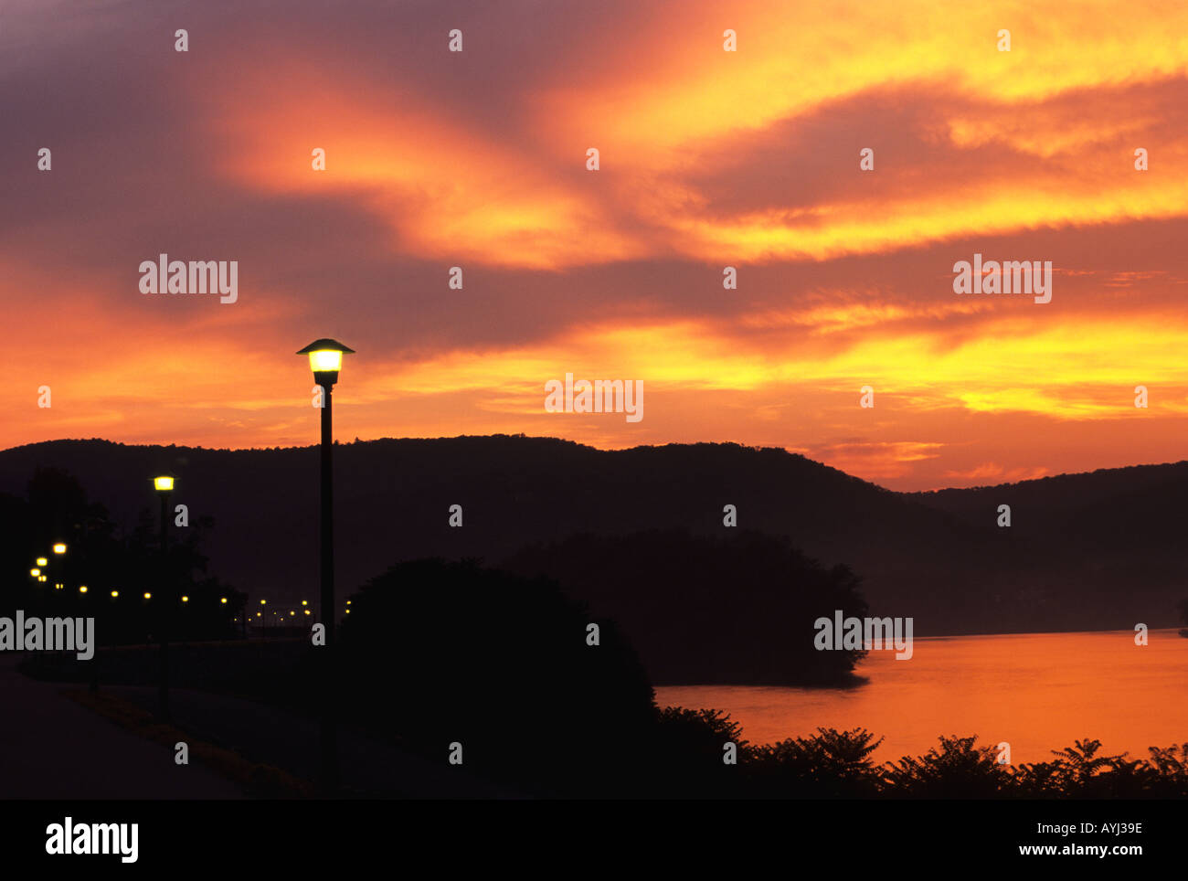 Lighted pathway along the Susquehanna River at sunset Pennsylvania  Stock Photo