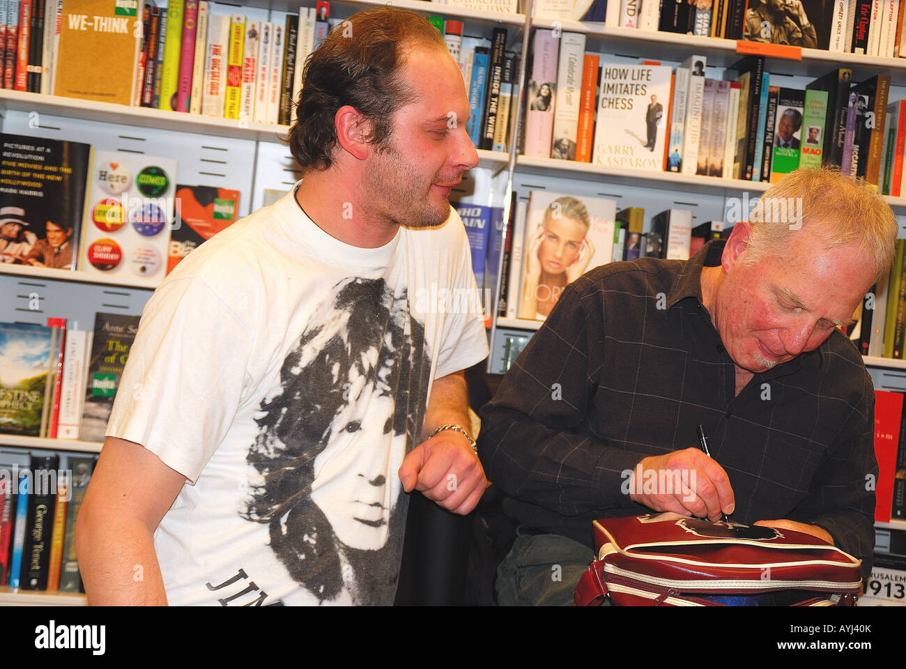 Frank Lisciandro with a fan at the presentation of his new book 'Jim Morrison : diario fotografico' in Padova Stock Photo