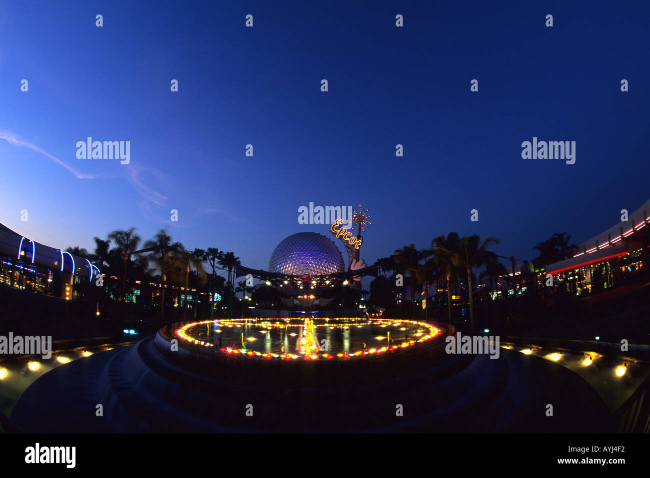 Fountain and Geosphere of Spacehip Earth at Epcot Center Disney World in Orlando Florida dusk  Stock Photo