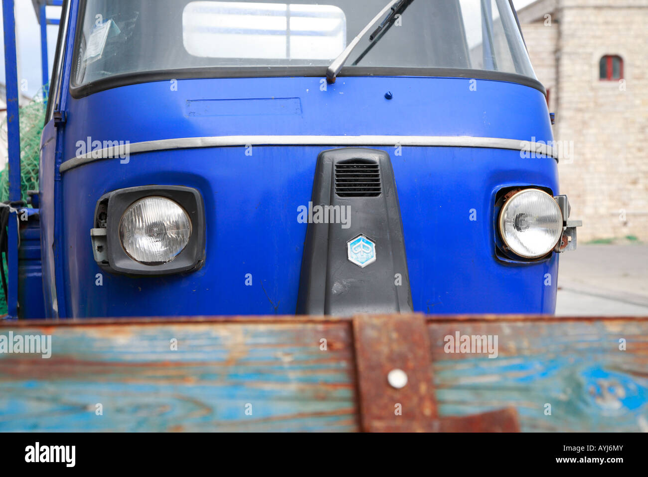blue piaggio ape three wheeled truck Stock Photo