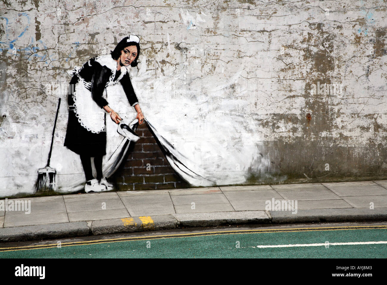 Banksy Maid Sweeping it Under the Carpet, Chalk Farm, London Stock