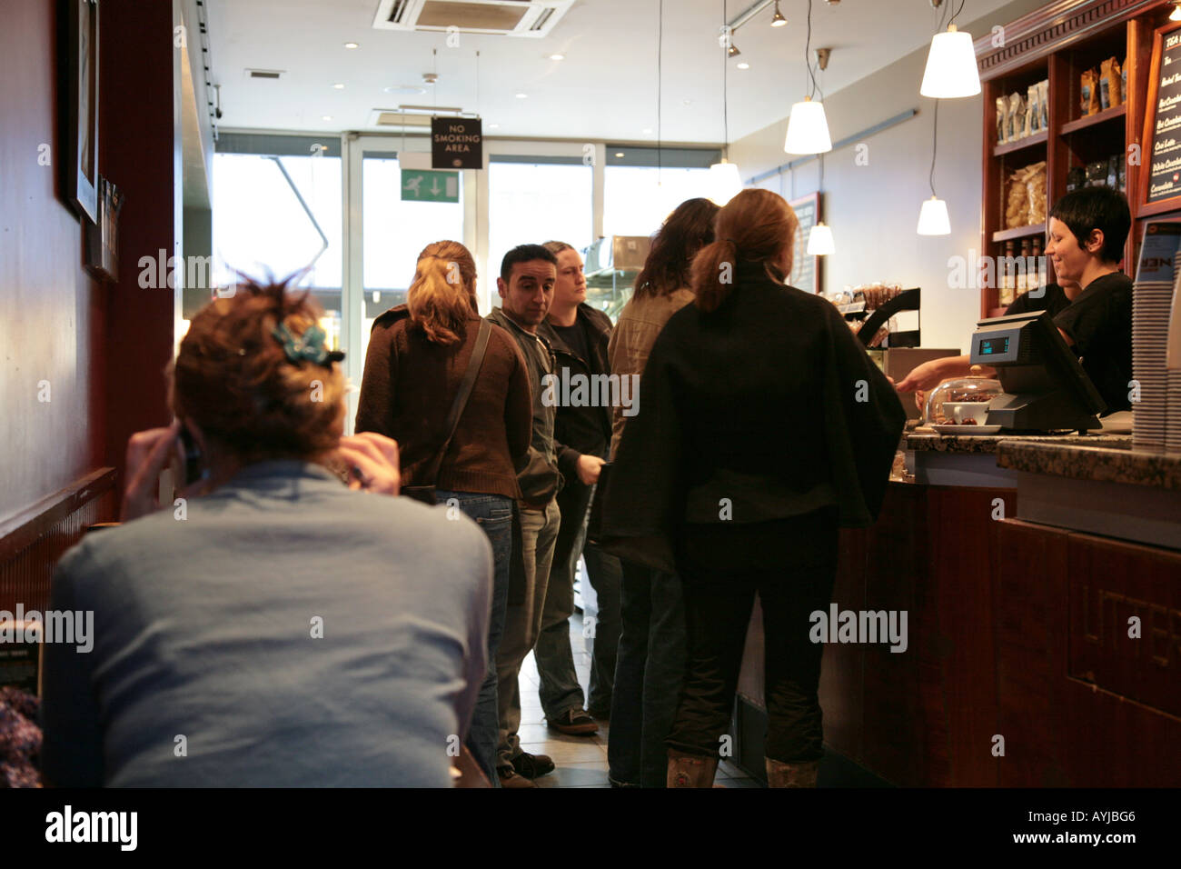 people queuing in coffee house Stock Photo