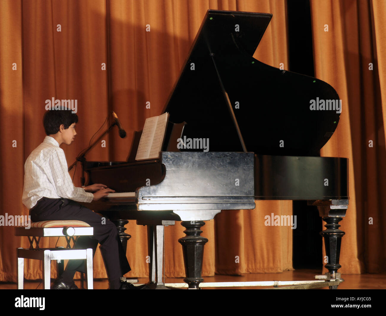 Boy Playing Grand Piano at Diwali Celebrations Wandsworth Town Hall London England Stock Photo