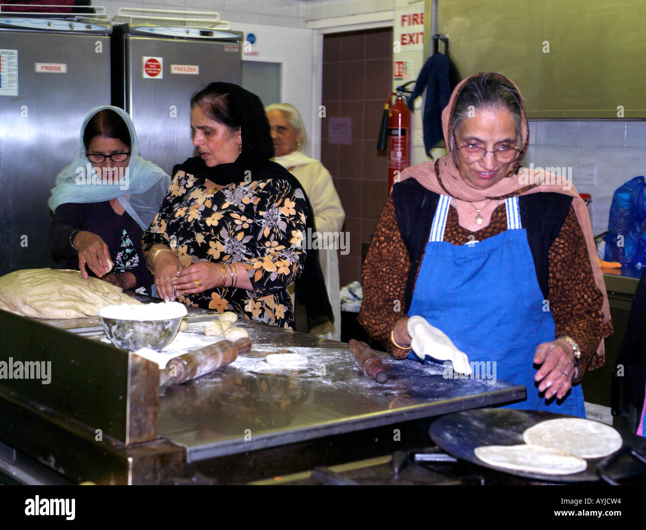 Khalsa Centre Tooting London England Women Making Chapatis in Kitchen