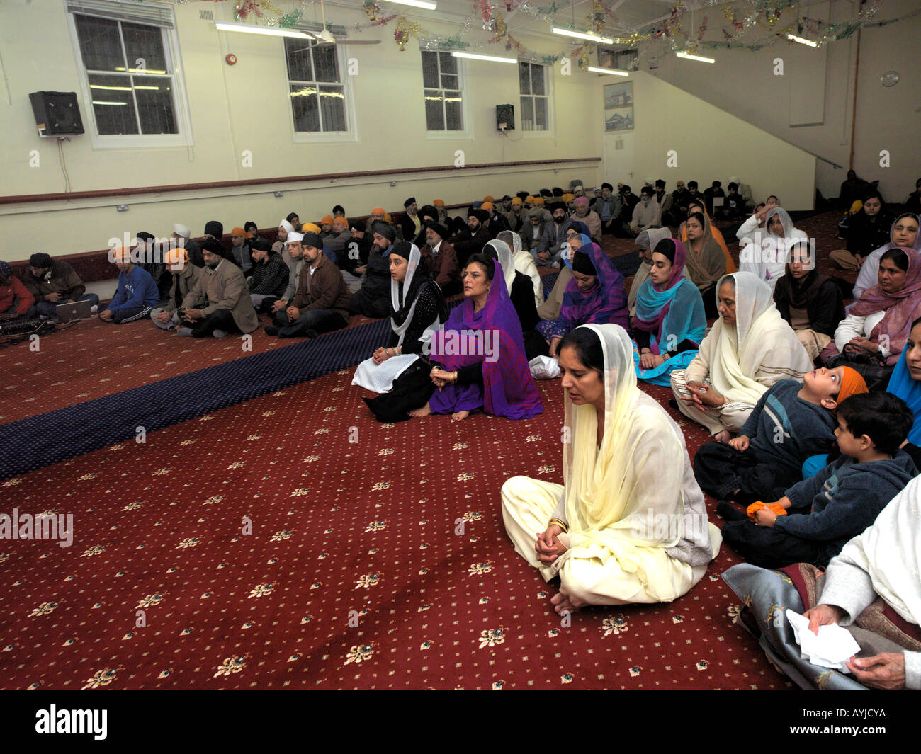 Khalsa Centre Tooting London England Congregation Divided in Gurdwara Men on Right Women on Left Stock Photo