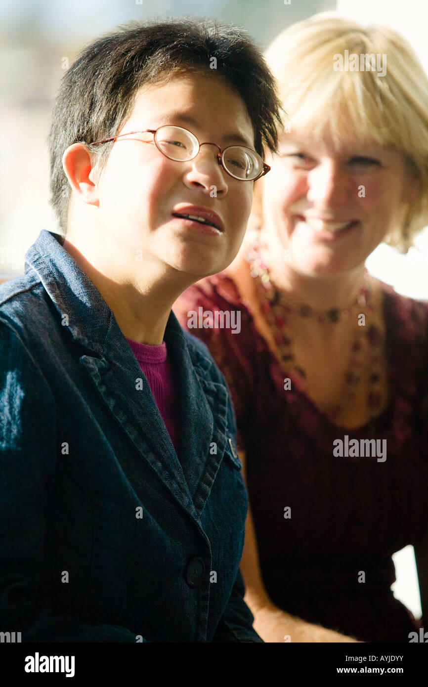 Portrait of man with woman in background Stock Photo