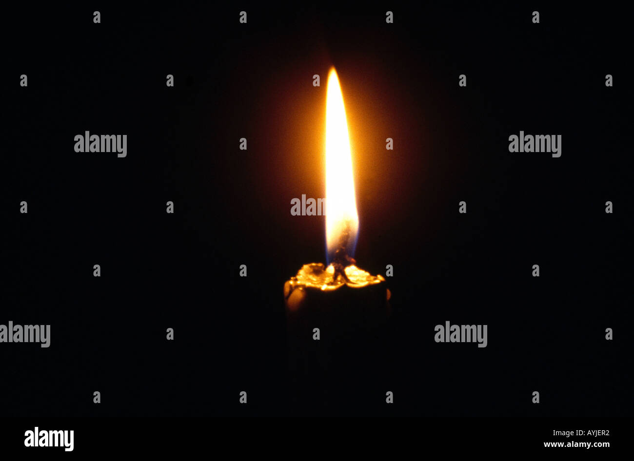 Glowing Candle In The Dark Brass Candlestick Stock Photo Alamy