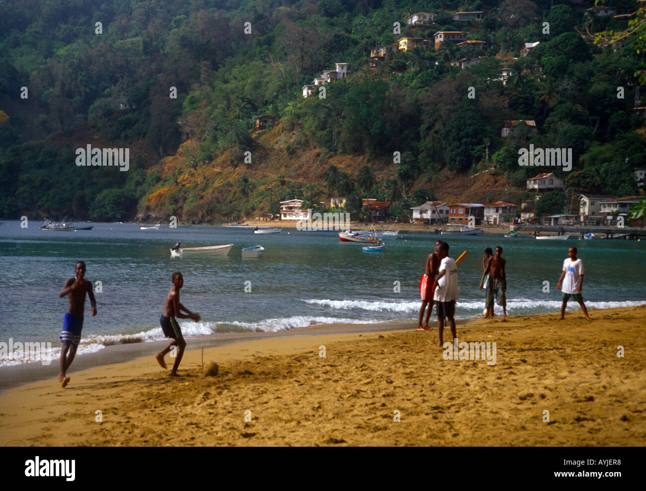 Charlottesville Tobago Boys Playing Cricket On The Beach Stock Photo