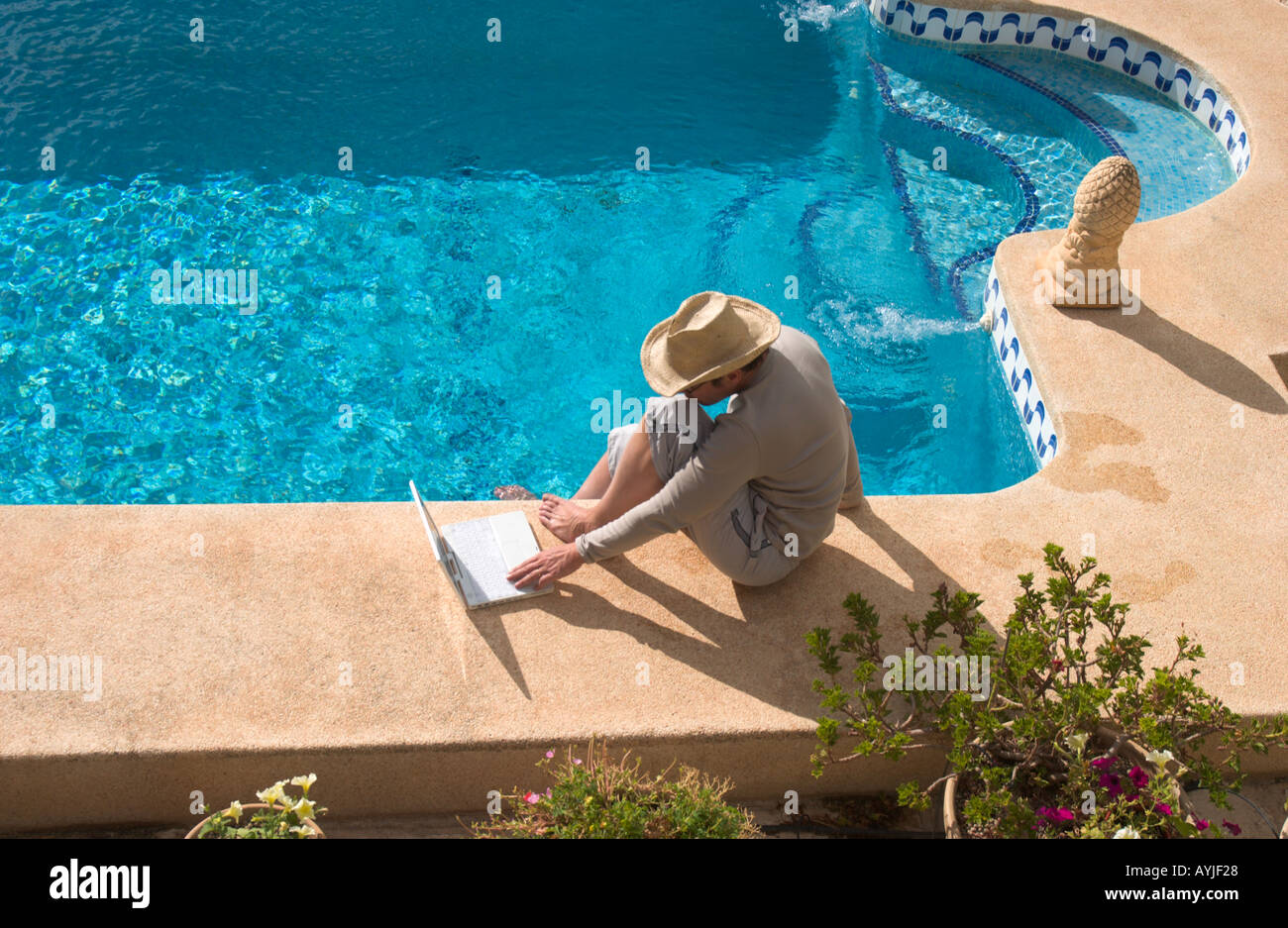 Working In A Pool Man working sitting swimming pool hi-res stock photography and images ...