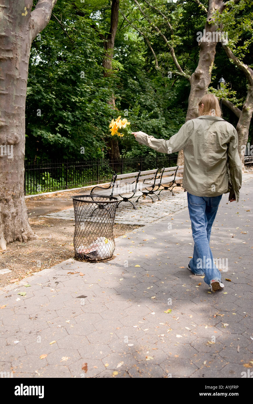 young Caucasian boy disheartened throwing away flowers Stock Photo Alamy