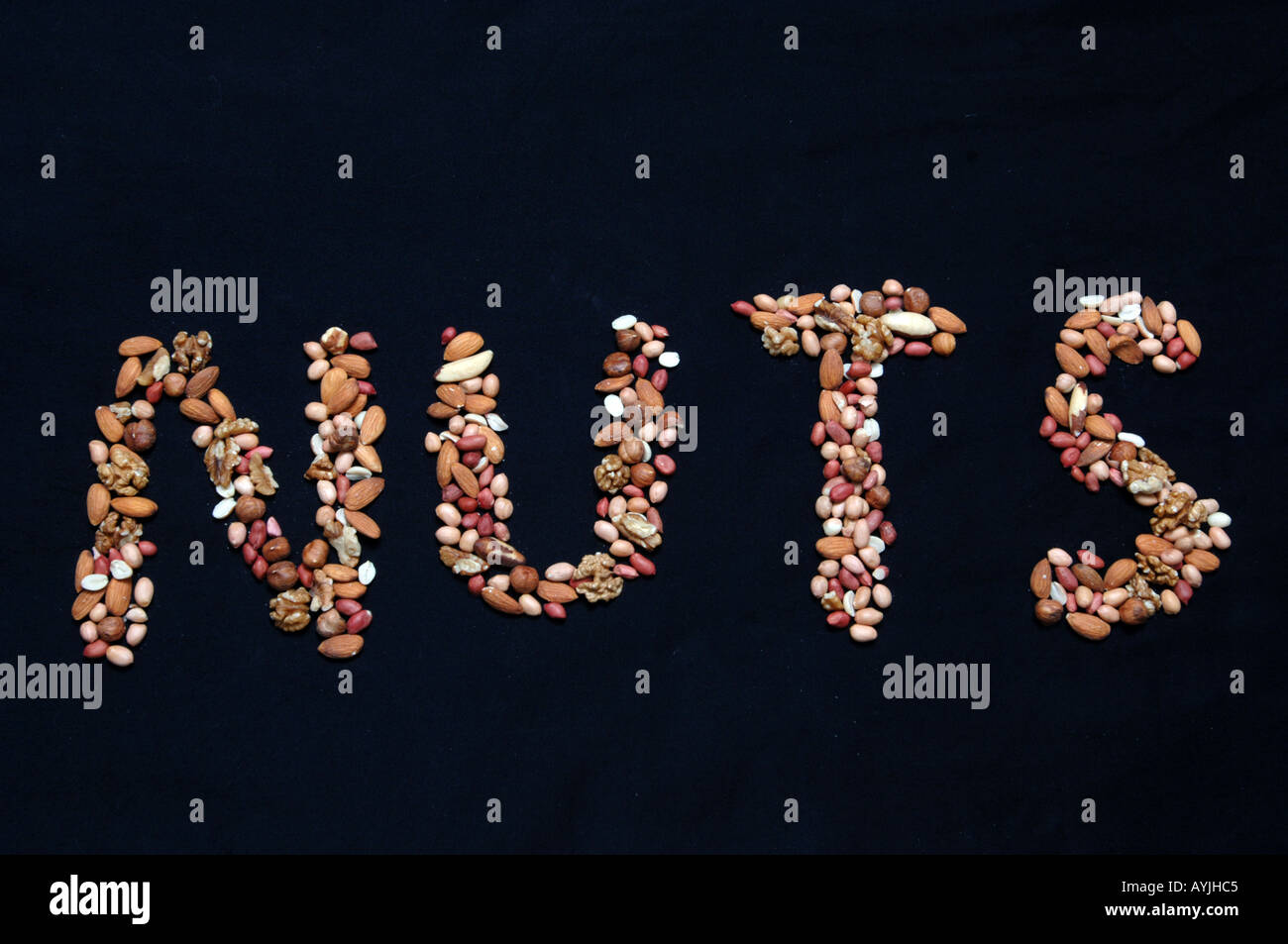 Mixed nuts spelling out the word nuts Stock Photo Alamy