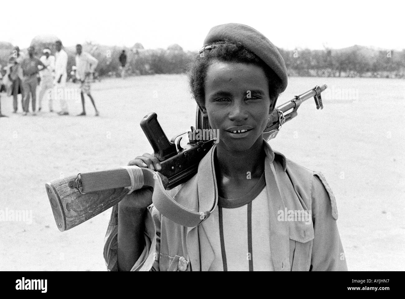B/W of a casual, TPLF soldier with kalashnikov, a border force guarding food aid for refugees near the border with Somalia. Kebrebeyah, Ethiopia Stock Photo