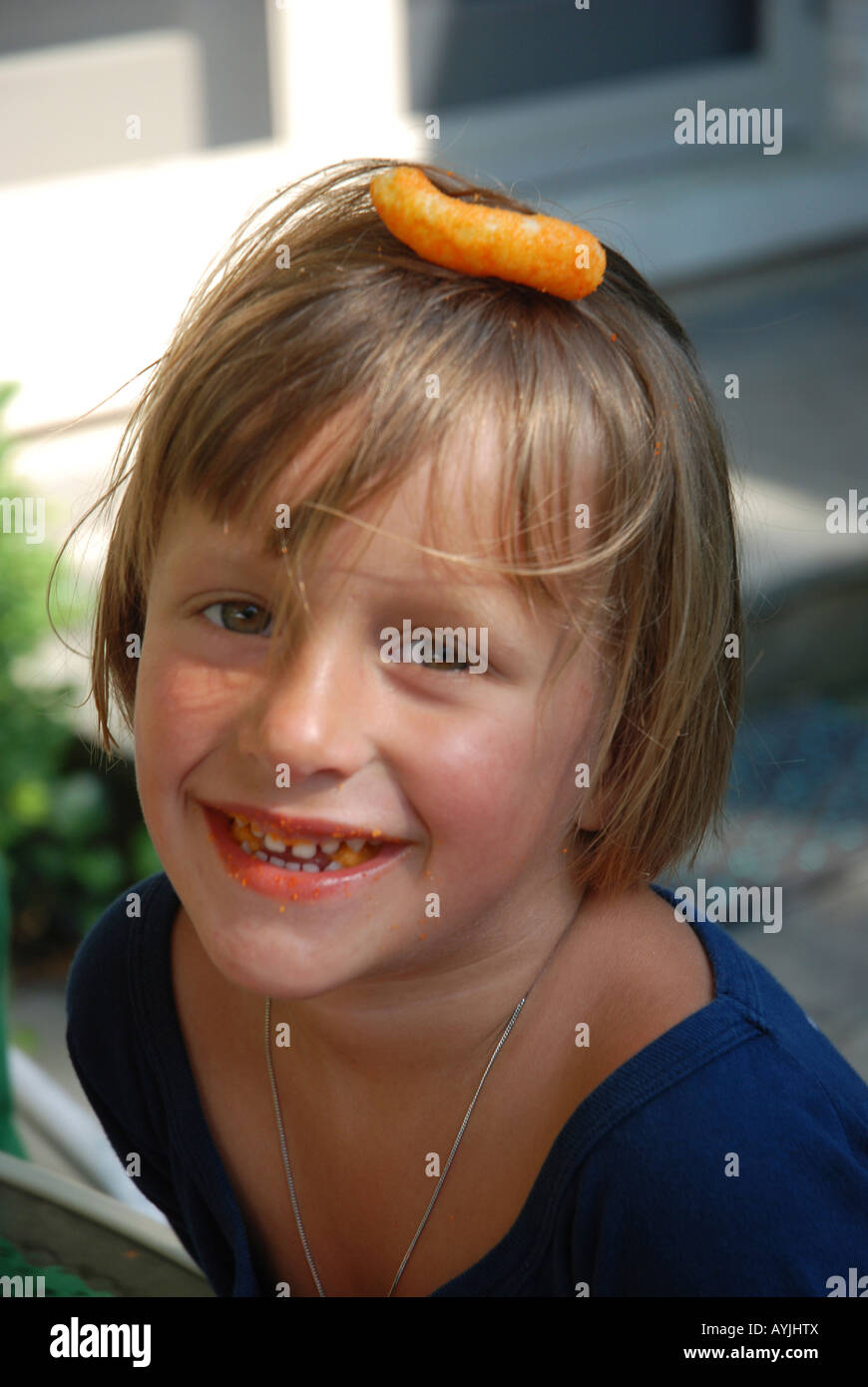girl with cheese puff Stock Photo Alamy