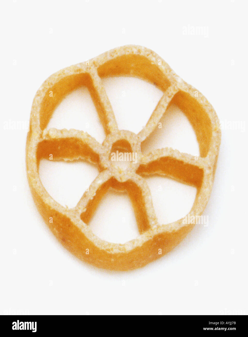 Wheel shaped brown pasta Stock Photo Alamy