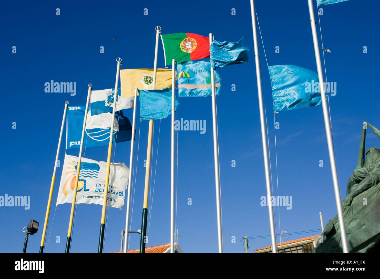 Flags flying on beach Praia de Mira Portugal Stock Photo Alamy