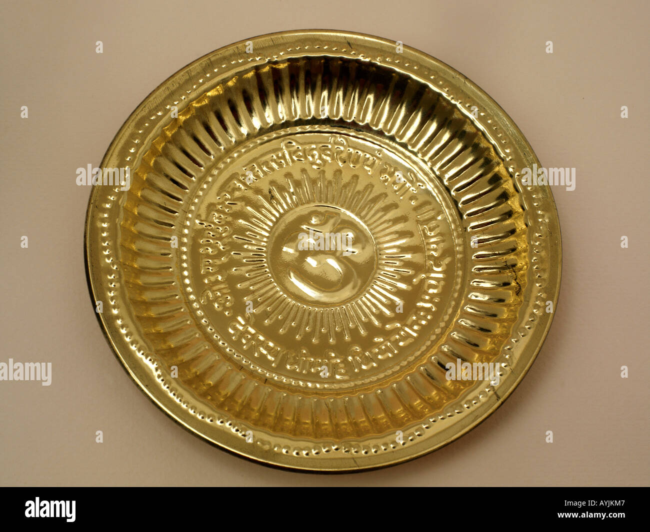 Brass Plate with Om Symbol Stock Photo