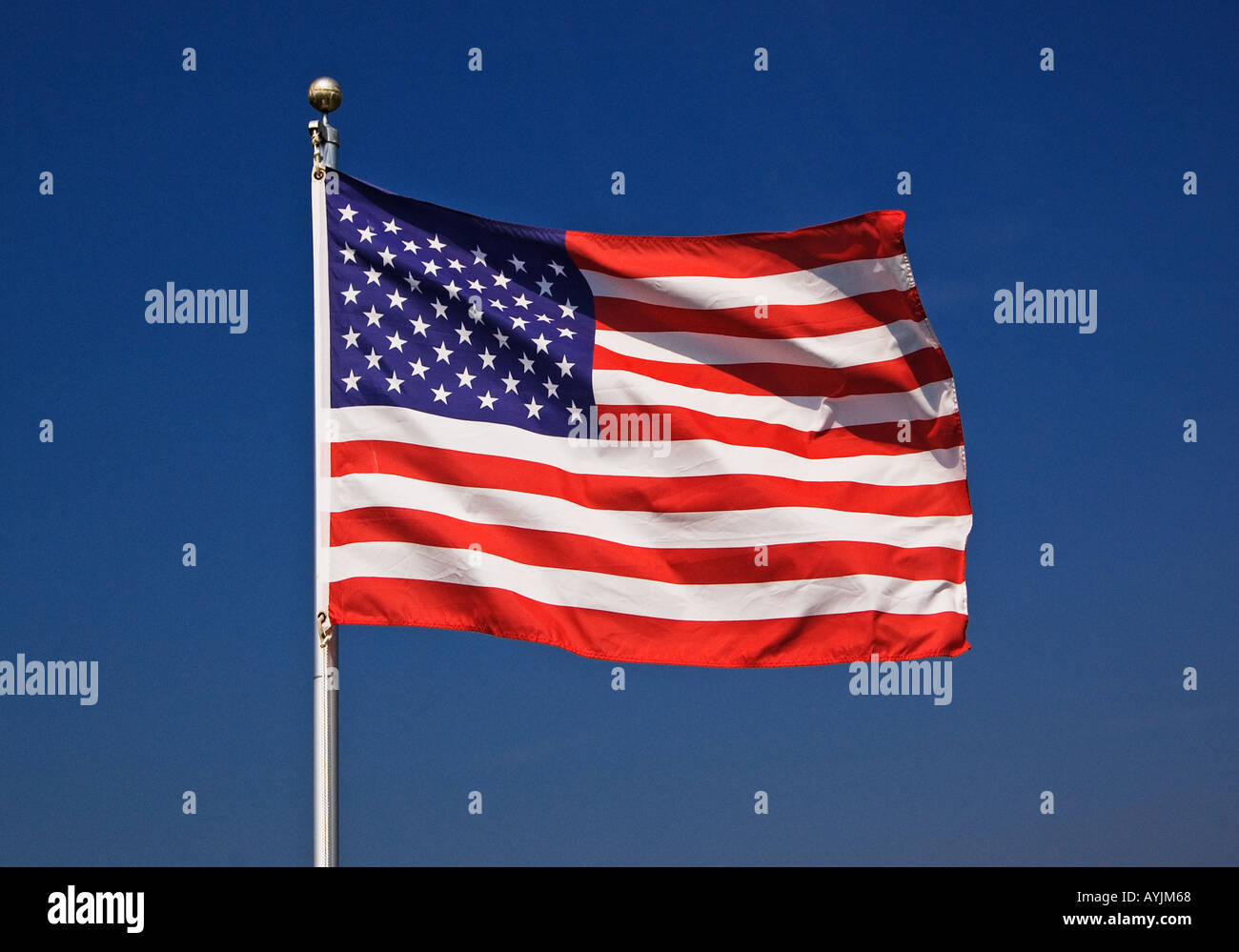 Flag Of The United States Of America Flying From Flagpole Stock Photo ...