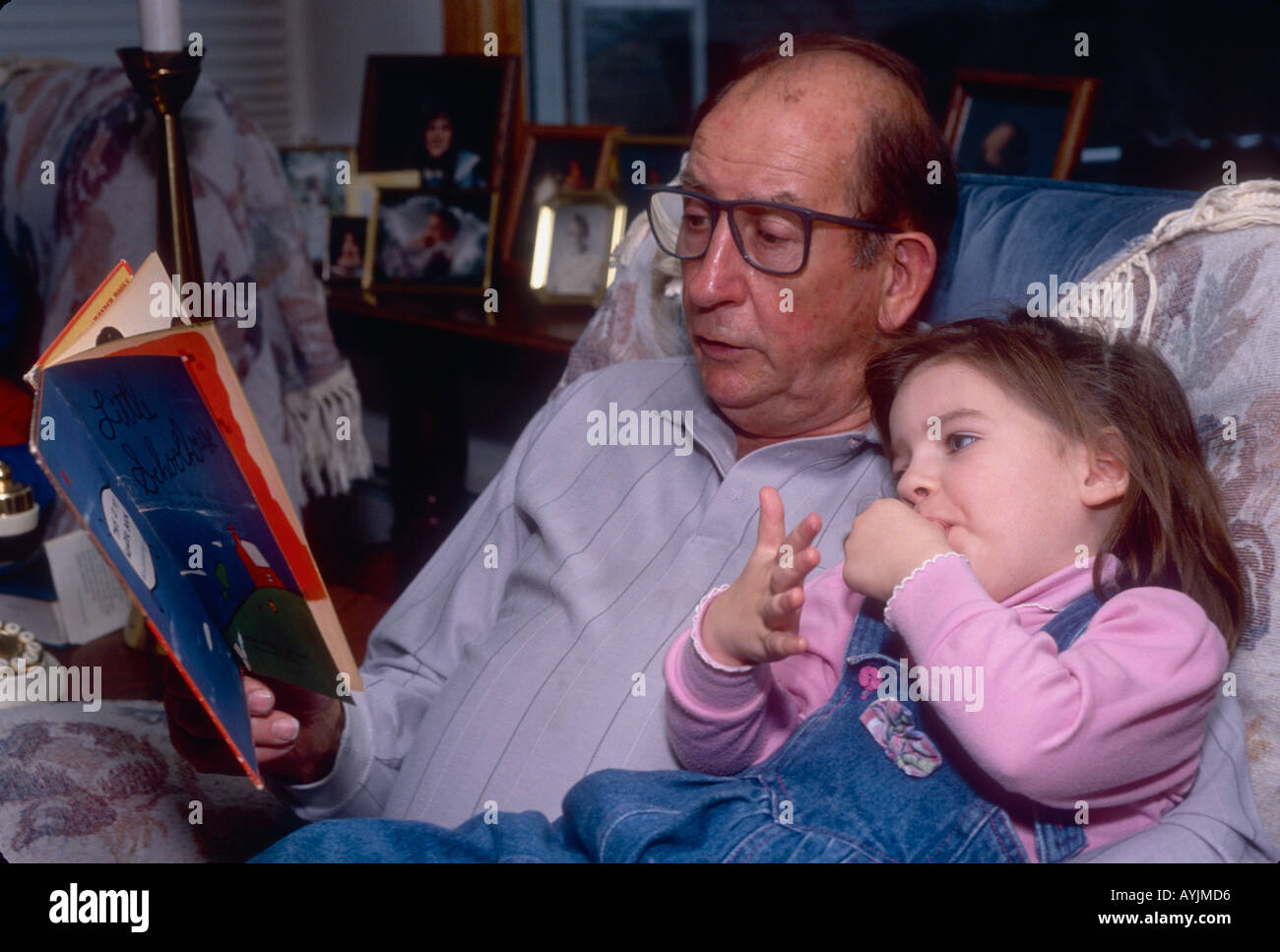 Grandfather Reading Book for Granddaughter Southern Indiana Stock Photo