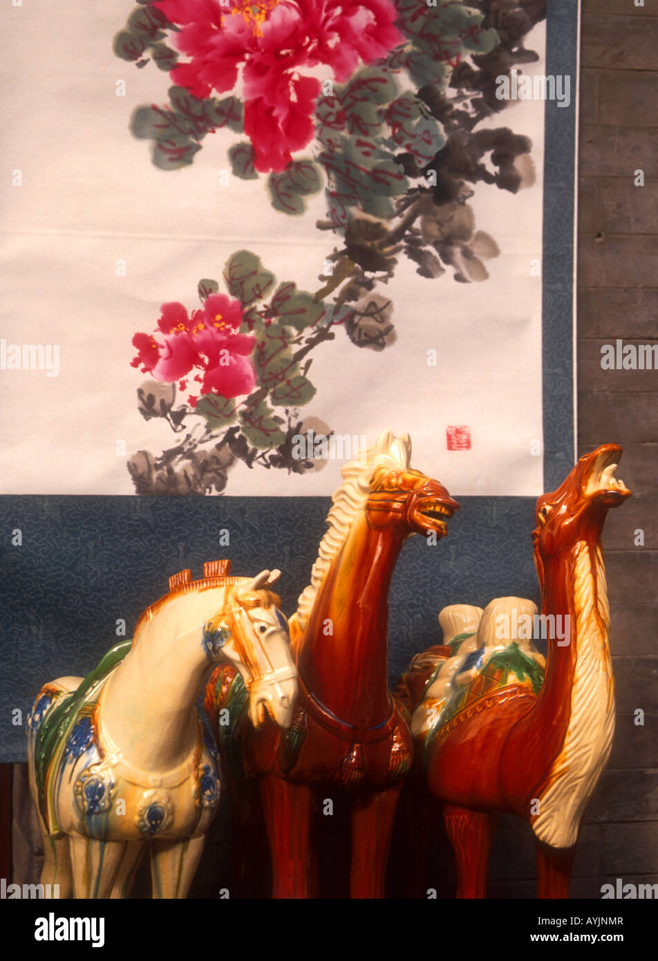 Xi'an souvenirs at shop in Book Courtyard street including Tang dynasty tri-colored glaze figurines and traditional painting Stock Photo