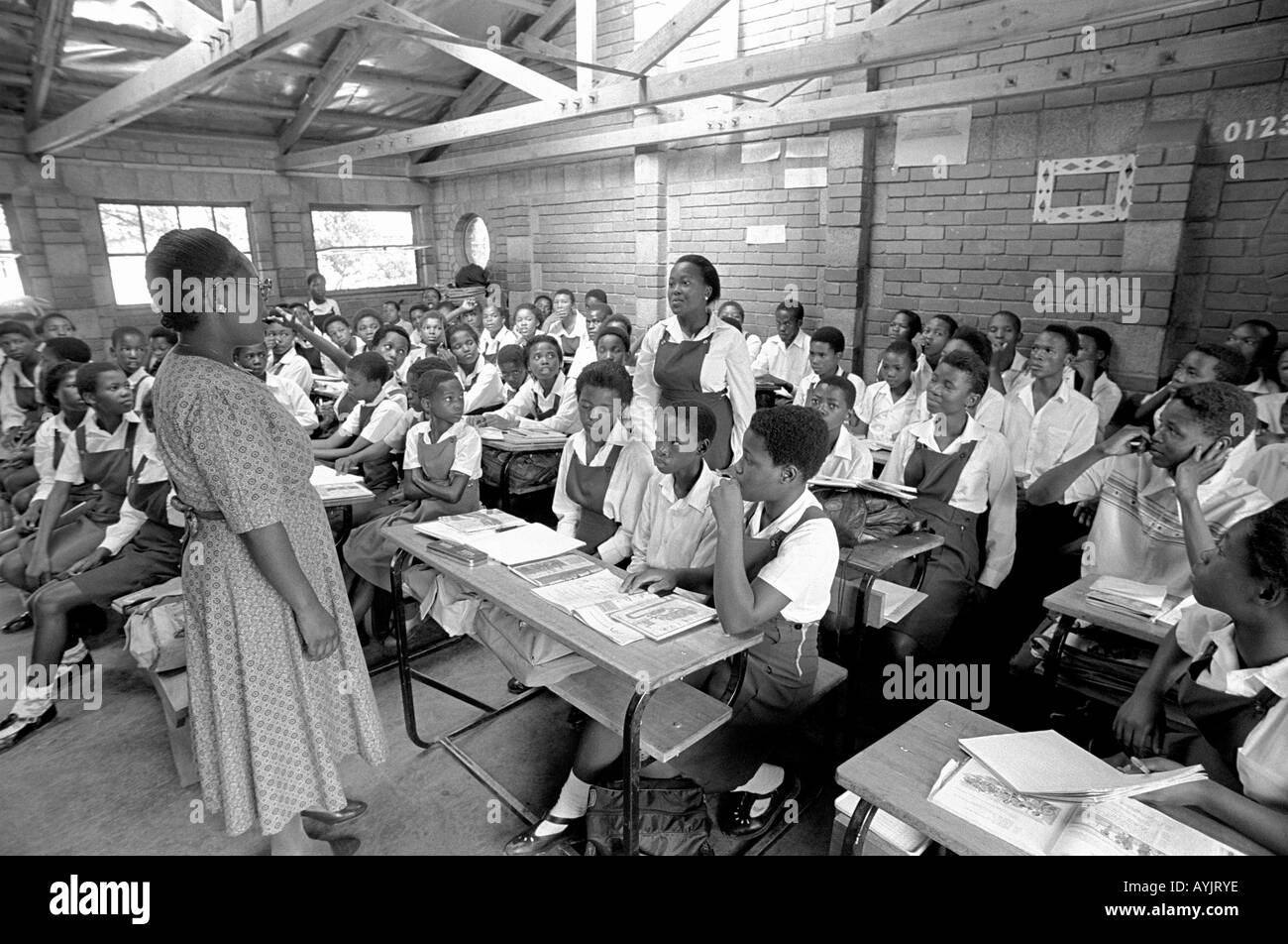 B/W of a classroom with a teacher and pupils in a rural African school. Lesotho, Southern Africa Stock Photo