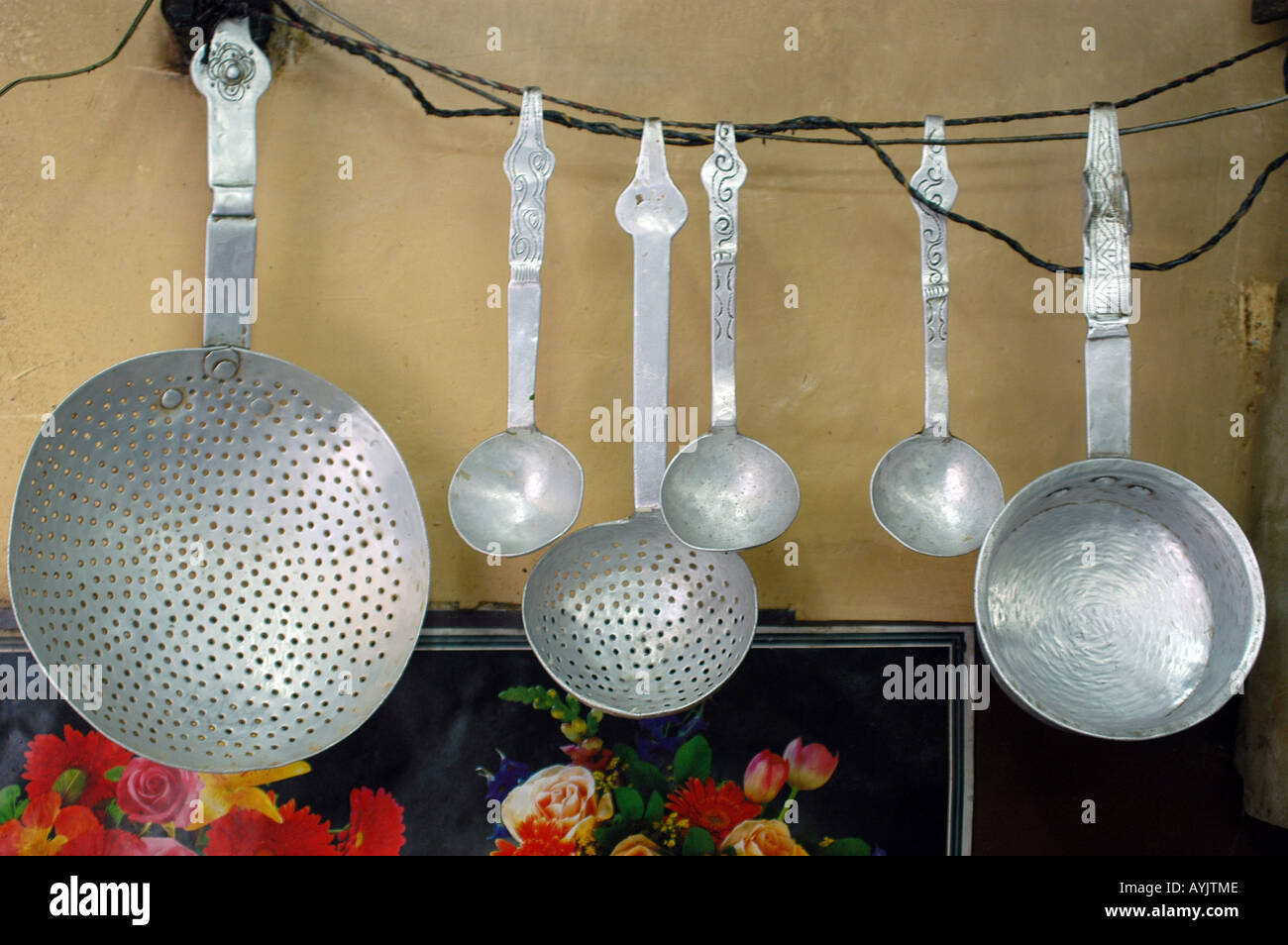 India Manali Kullu District Himachal Pradesh Northern India crude tin kitchen utensils in a