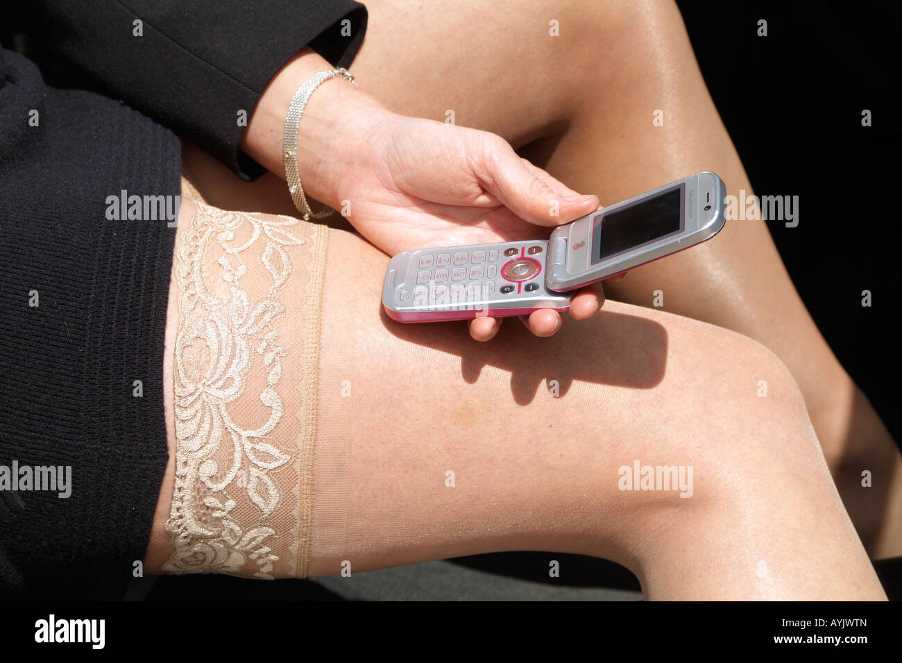 Mature Woman Stocking Tops and Mobile Phone Stock Photo - Alamy