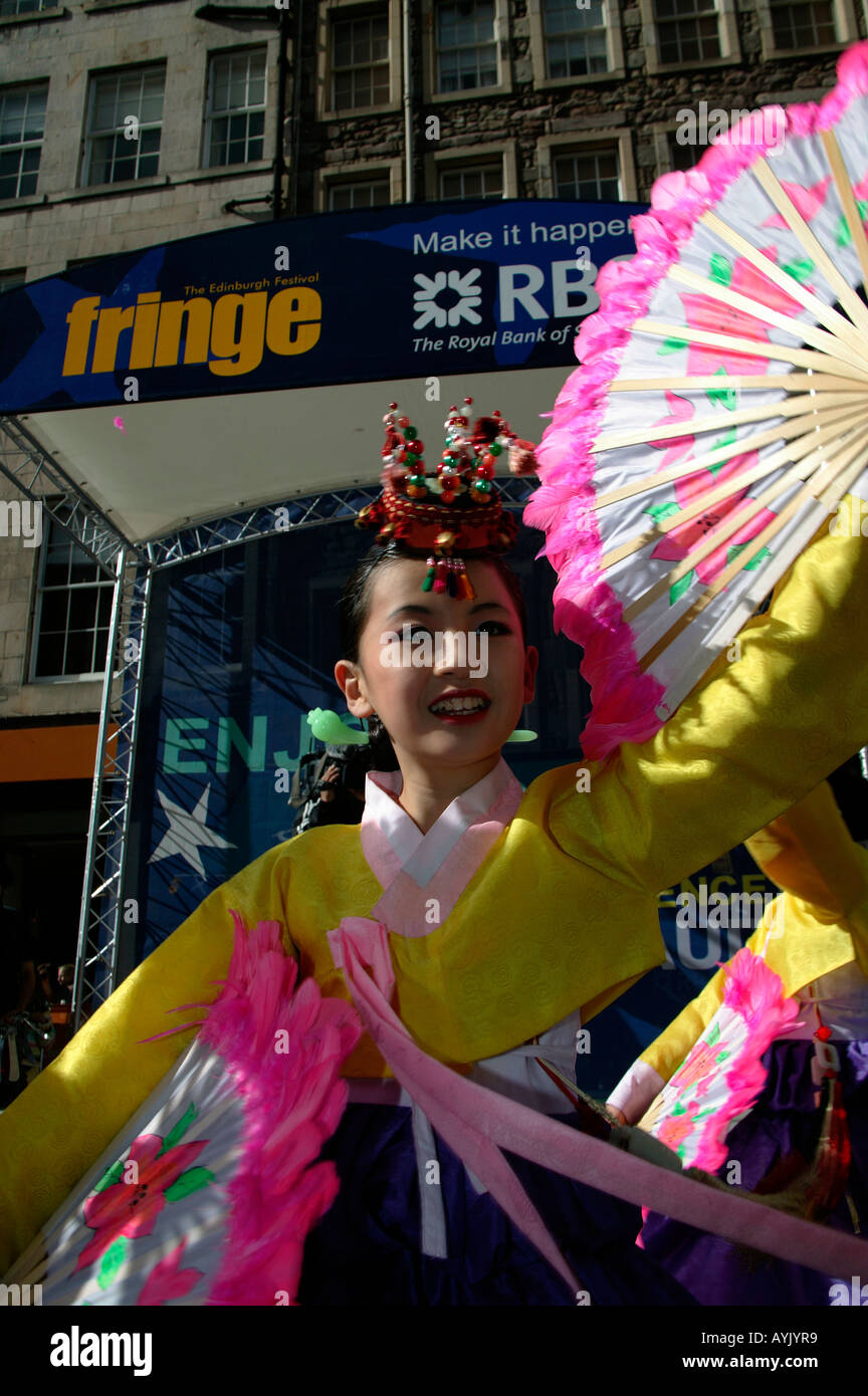 Young Korean dancer with fan promoting her stage show Edinburgh Fringe Festival, Scotland Stock Photo