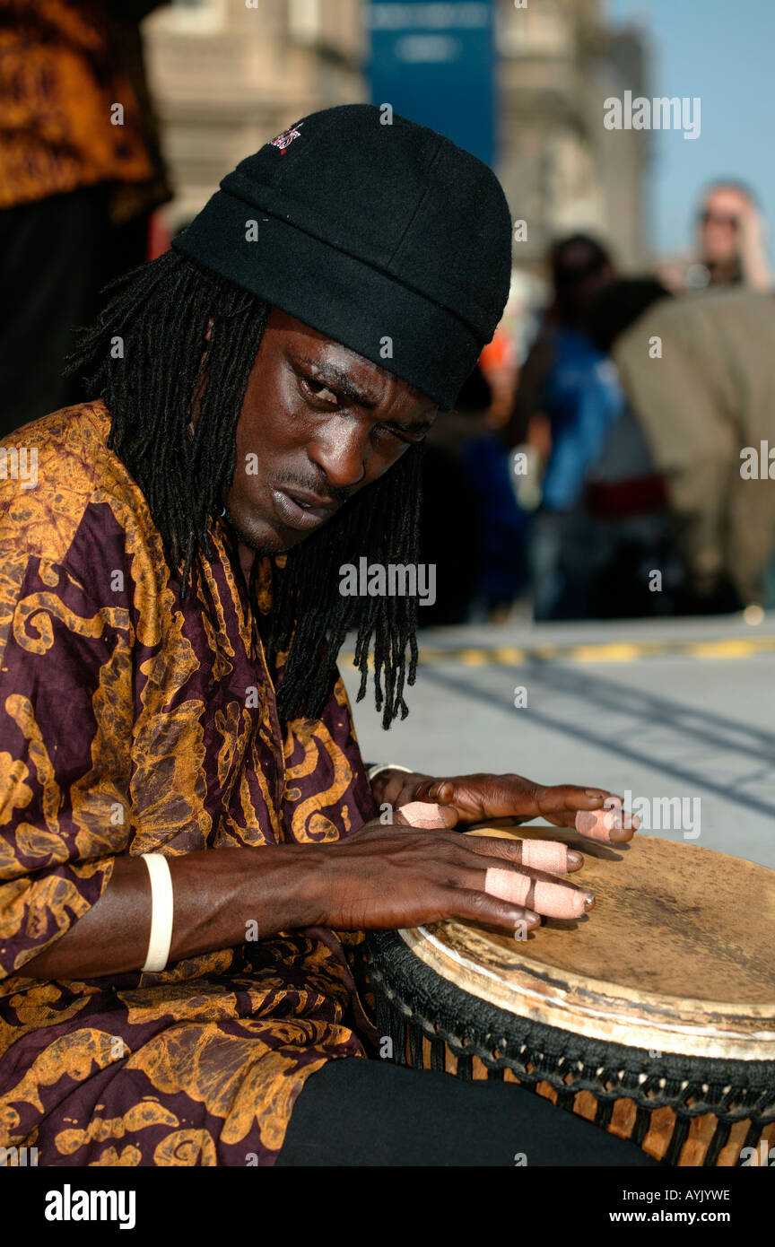 Black musician playing drum Edinburgh Fringe Festival Scotland Stock Photo
