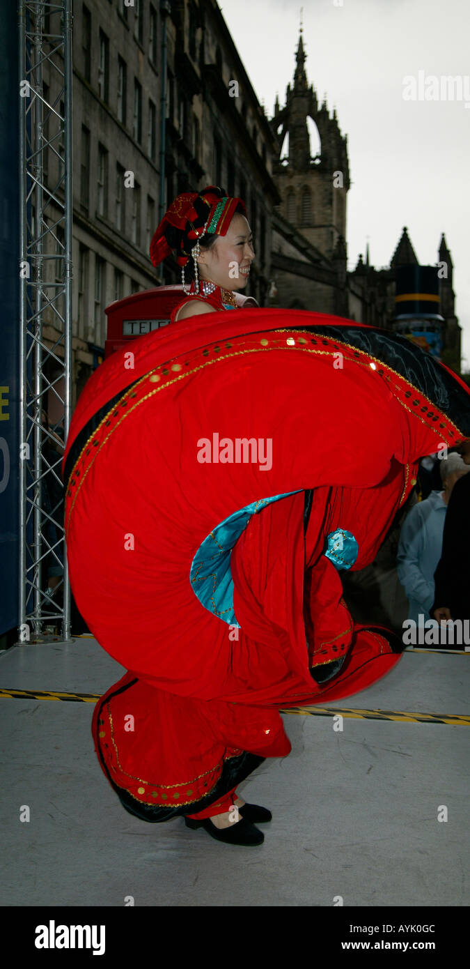 Red Fan dancer, promoting show on stage, Edinburgh Fringe Festival Scotland, UK, Europe Stock Photo
