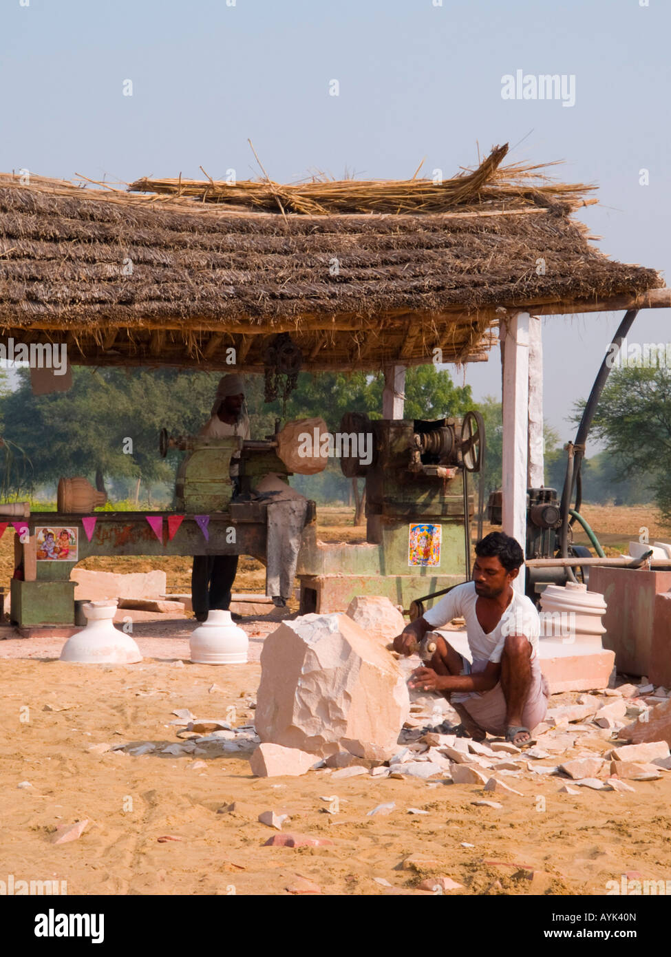 Sikandra Rajasthan India Asia Stone mason working on large piece of