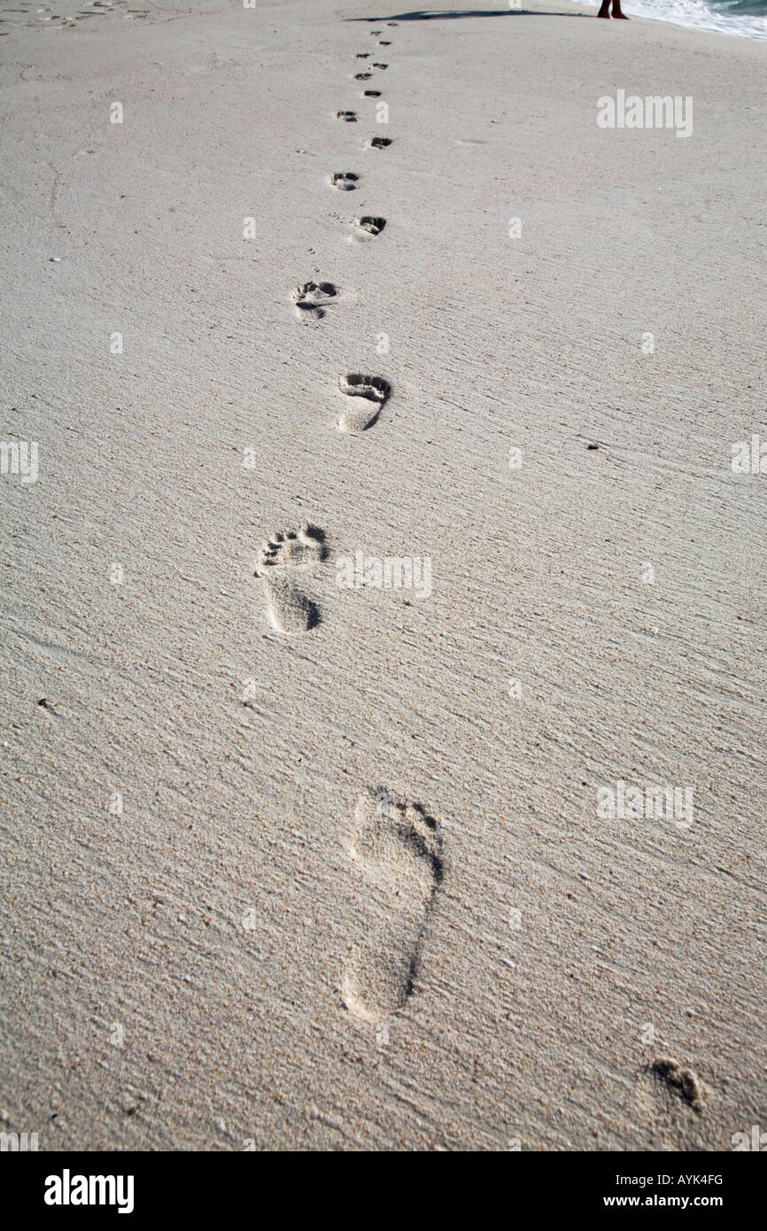 Human footprints on beach Stock Photo