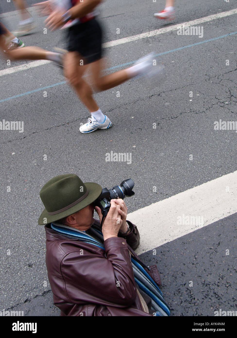 Photographer taking pictures of the marathon 2008 rue de Lyon near Bastille Paris France Stock Photo