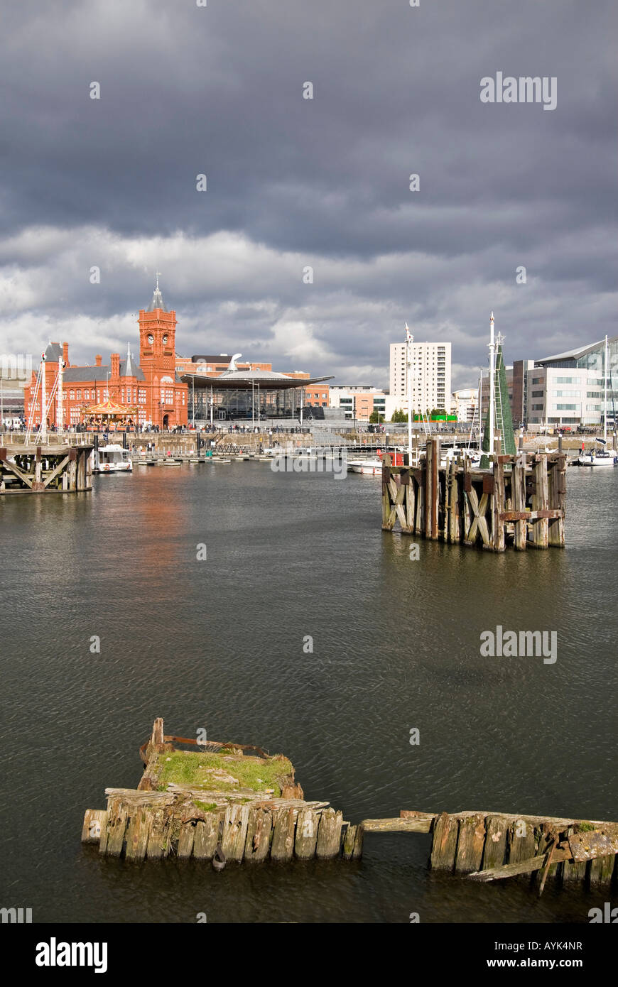 Vertical view of Mermaid Quay and Pierhead Building at the Cardiff Bay Development with thundery clouds in the background Stock Photo