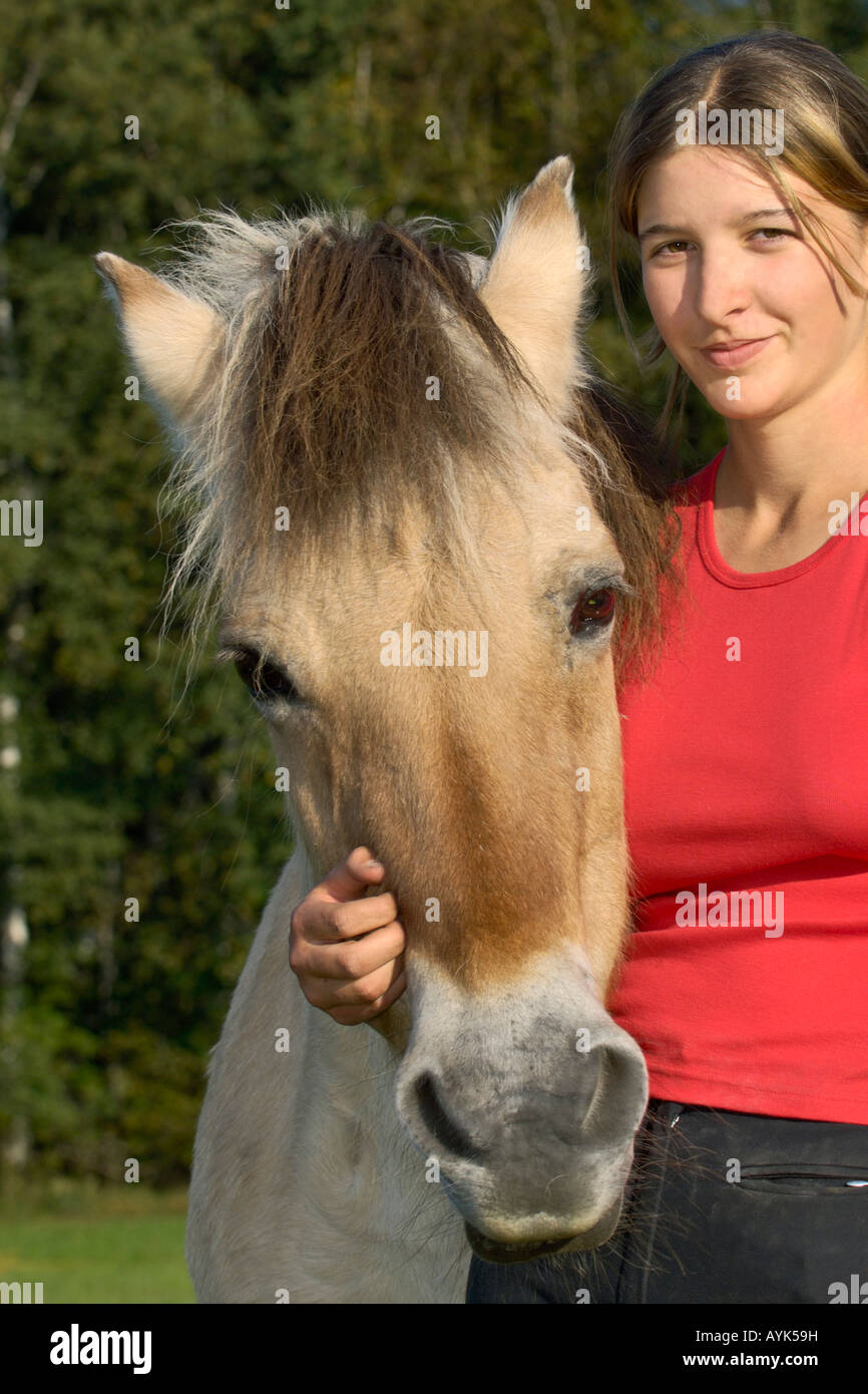 Norwegian horse with girl portrait Stock Photo Alamy