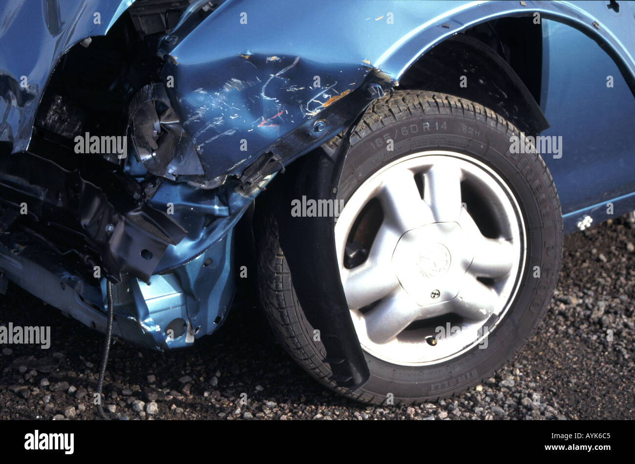 Crunched front end of car after road traffic accident Stock Photo