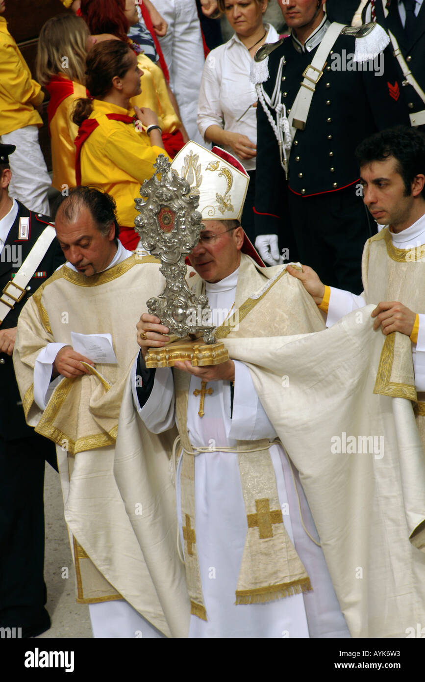 Bishop of Gubbio holding a religious relic in a procession part of the Gubbio Ceri race day on May 15 Stock Photo