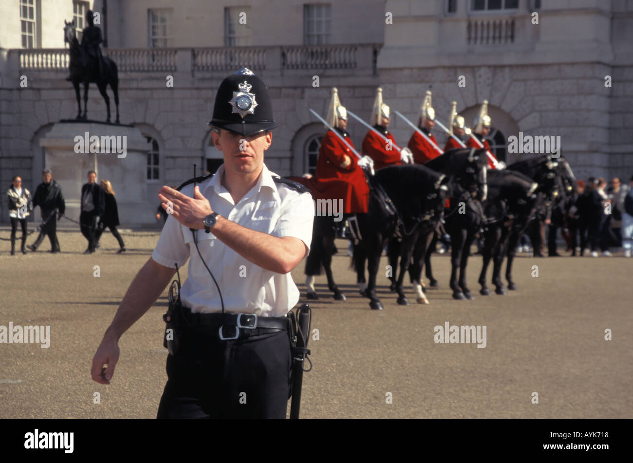 London Horse Guards Household Cavalry Mounted Regiment The Life Guards changing guard policeman directing tourists Stock Photo