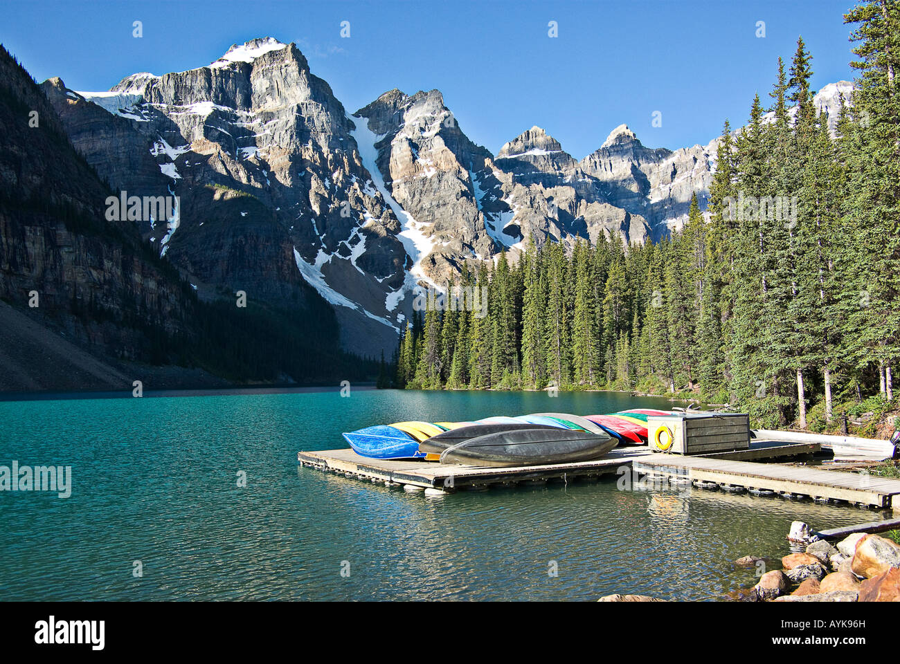 Canoes Docked At Moraine Lake, Banff National Park, Alberta Stock Photo ...