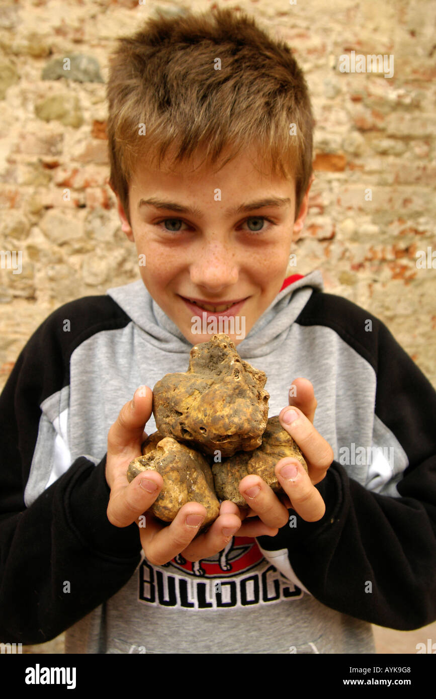 Boy with white truffles upright vertical portrait Stock Photo