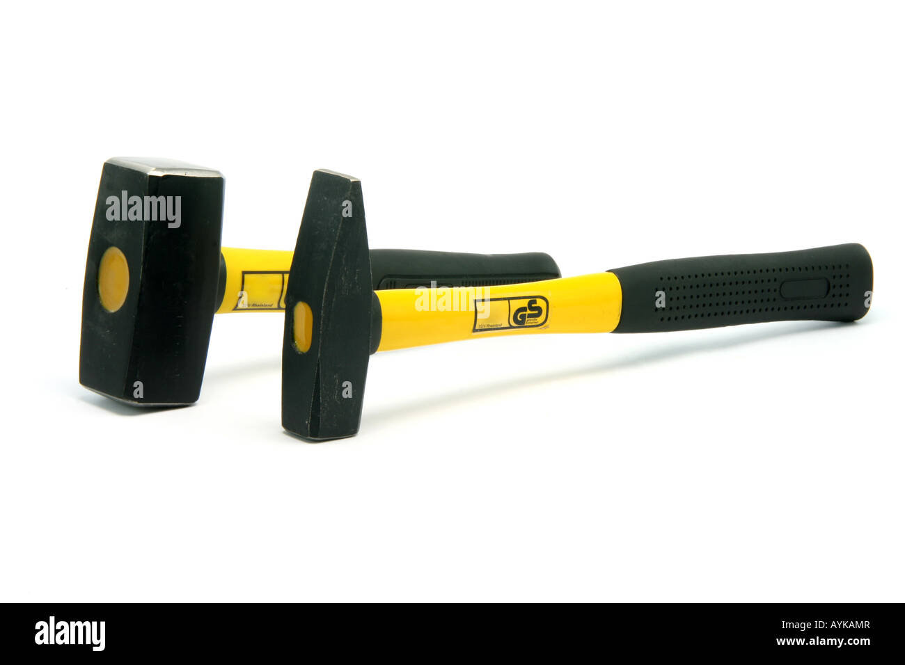 two yellow hammers isolated on white background construction industry