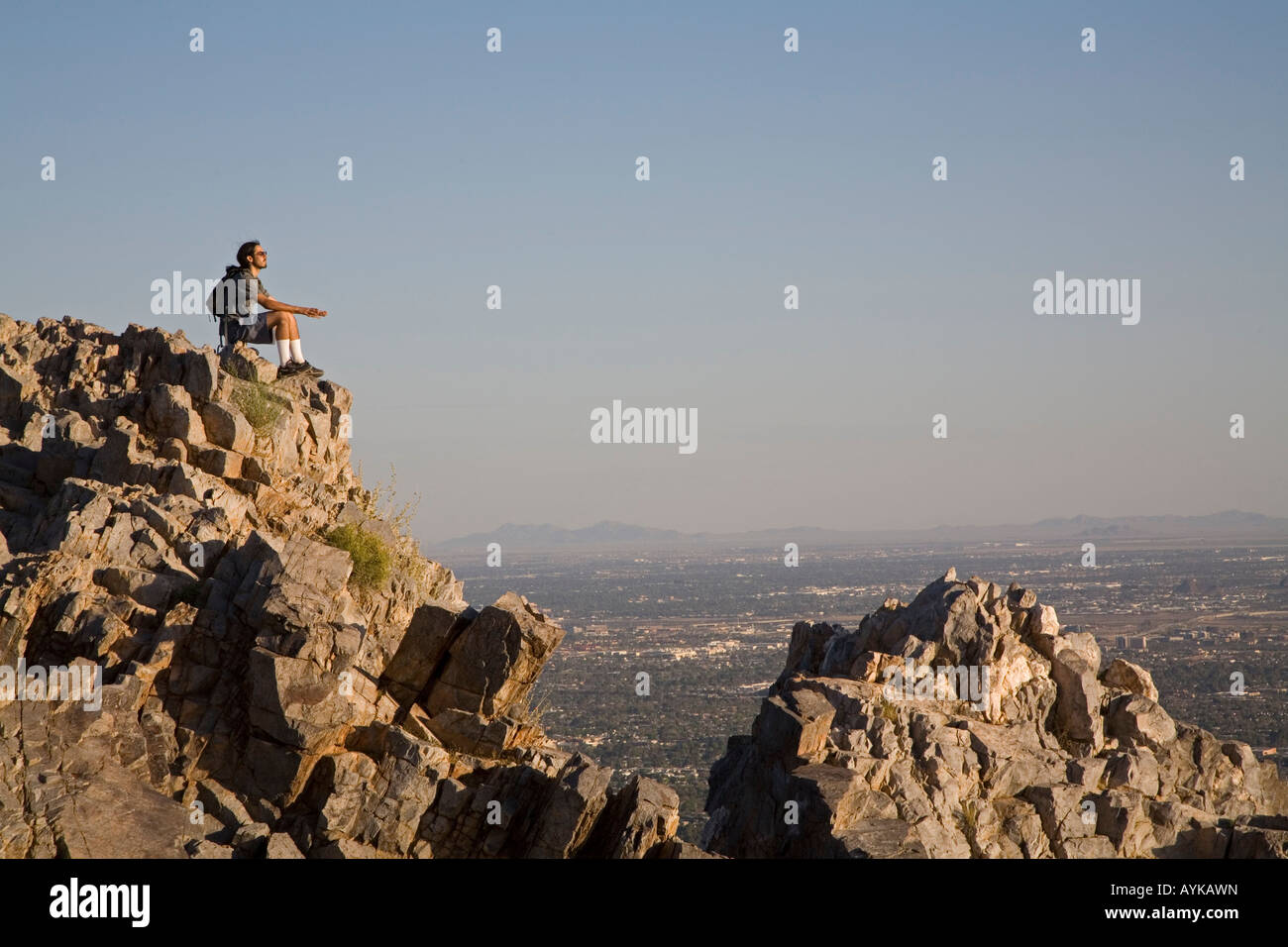 Hiker Rests Meditates at Top of Piestewa Peak Stock Photo